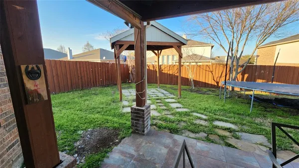 a view of a backyard with a garden