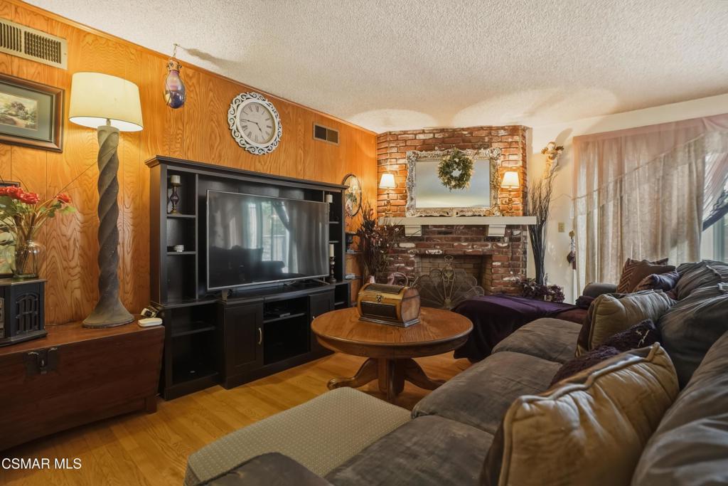558 East Hemlock Street Oxnard, CA 93033 - Photo 11 of 22 a living room with furniture and a wooden floor