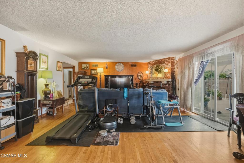 558 East Hemlock Street Oxnard, CA 93033 - Photo 12 of 22 a view of a living room with furniture and floor to ceiling window