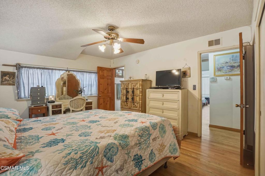 558 East Hemlock Street Oxnard, CA 93033 - Photo 14 of 22 a bed room with a bed and furniture