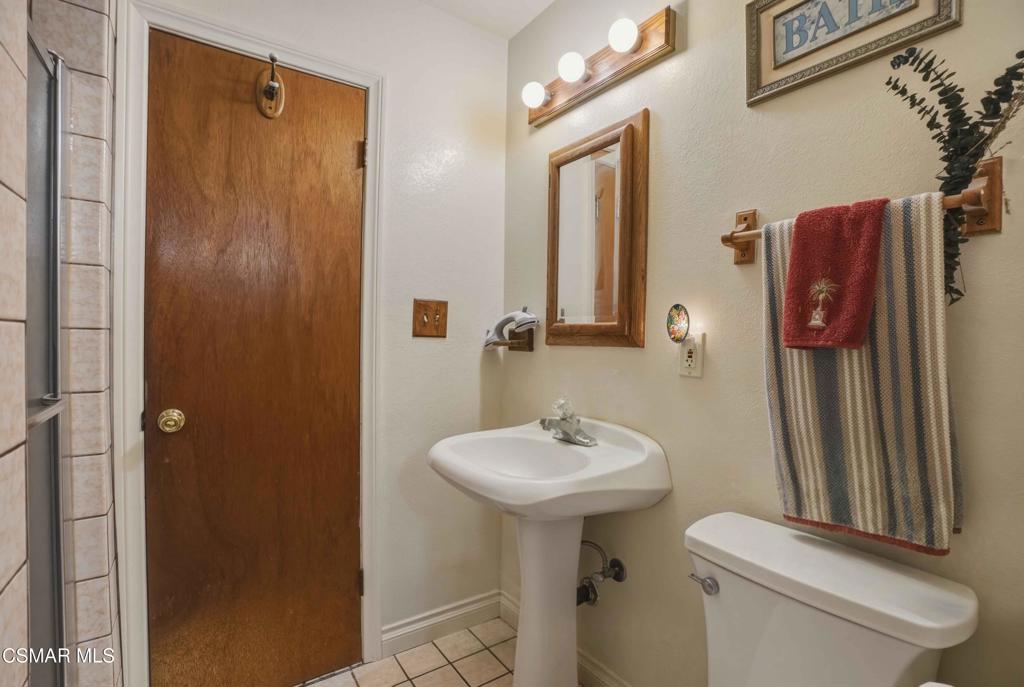 558 East Hemlock Street Oxnard, CA 93033 - Photo 16 of 22 a bathroom with a sink toilet and shower