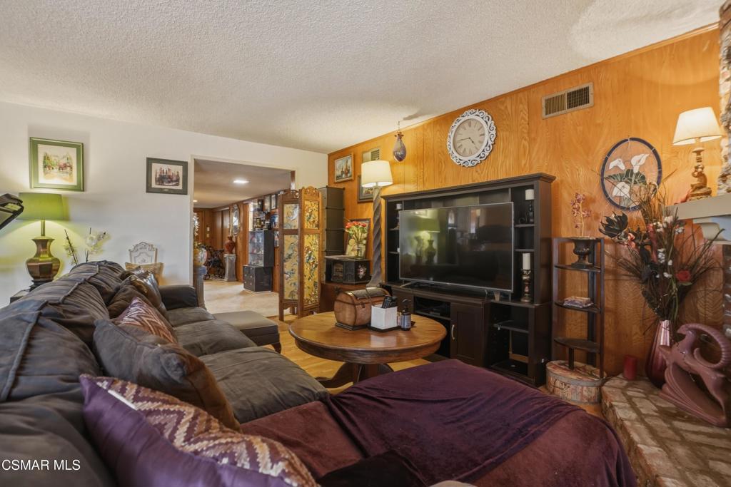 558 East Hemlock Street Oxnard, CA 93033 - Photo 10 of 22 a living room with furniture and a wooden floor