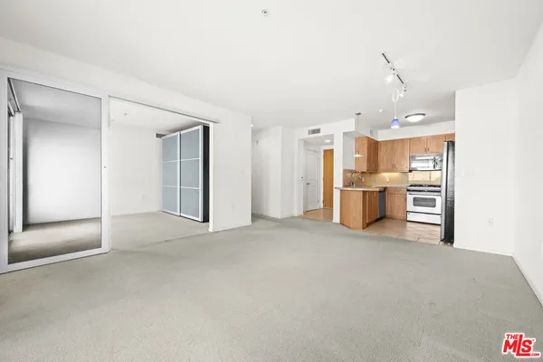 a view of a hallway with a white walls