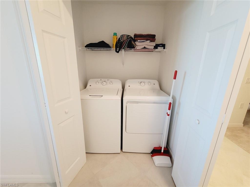 43997 Boardwalk Loop, Unit 1832 Babcock Ranch, FL 33982 - Photo 16 of 22 a utility room with dryer and washer