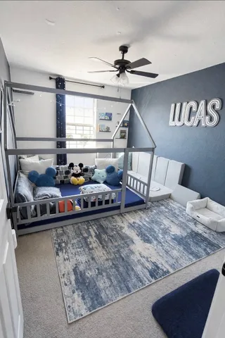 a bed room with a bed and a night stand