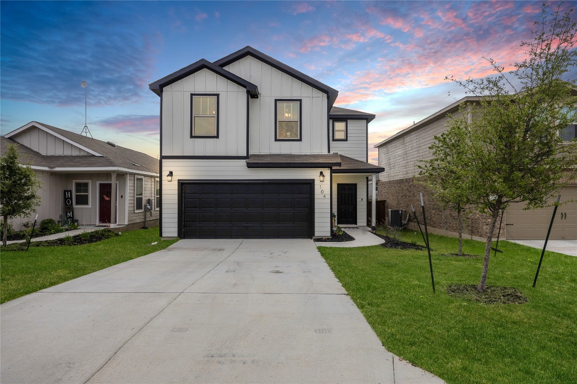 104 Hellfighters Way Jarrell, TX 76537 - Photo 2 of 27 a front view of a house with a yard