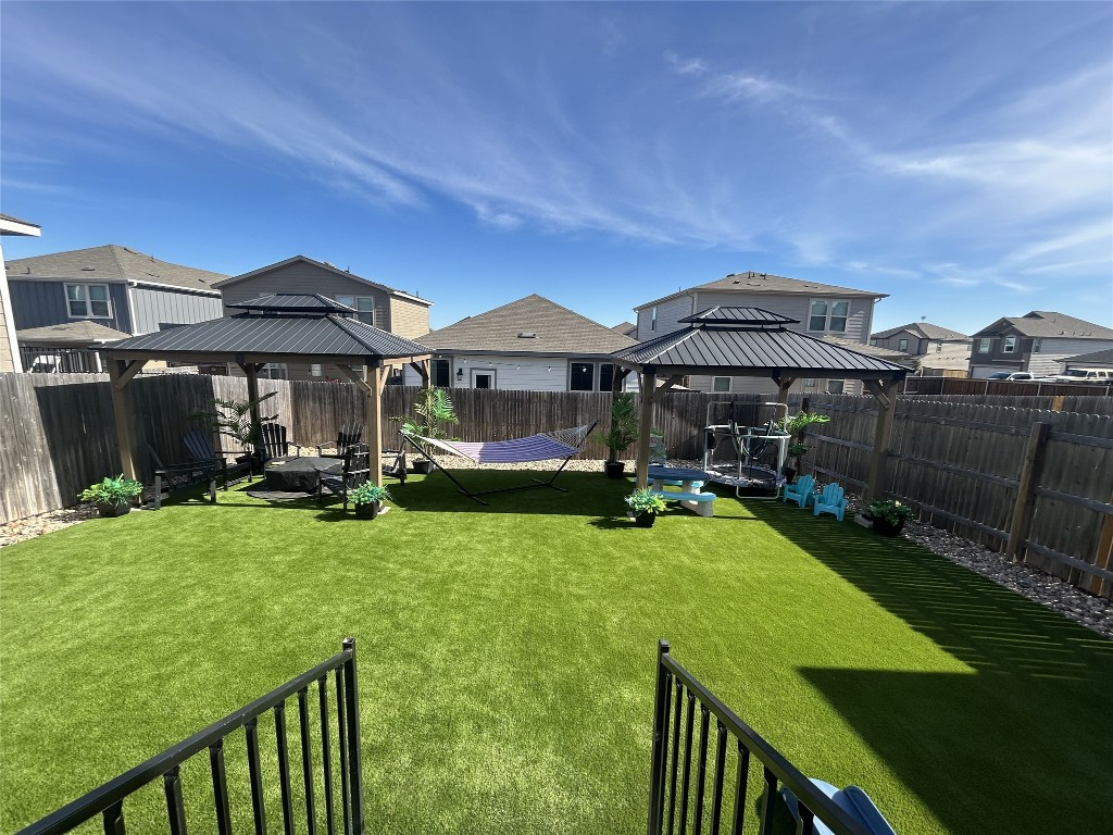 104 Hellfighters Way Jarrell, TX 76537 - Photo 25 of 27 a front view of a house with yard porch and furniture