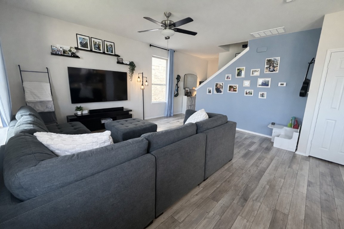 104 Hellfighters Way Jarrell, TX 76537 - Photo 6 of 27 a living room with furniture and a flat screen tv