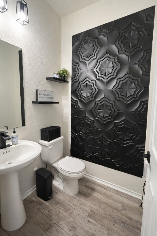 104 Hellfighters Way Jarrell, TX 76537 - Photo 8 of 27 a bathroom with a toilet sink and mirror