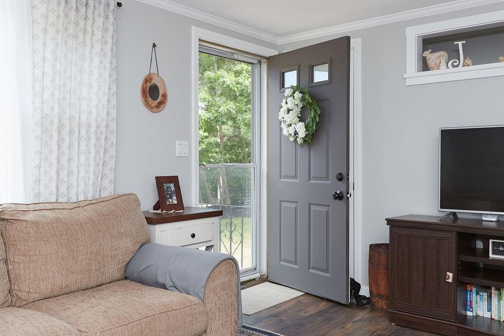 68 Barker Road Wareham, MA 02538 - Photo 3 of 17 a living room with furniture and a flat screen tv