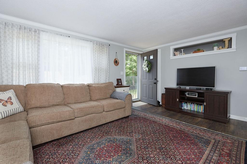 68 Barker Road Wareham, MA 02538 - Photo 4 of 17 a living room with furniture and a flat screen tv