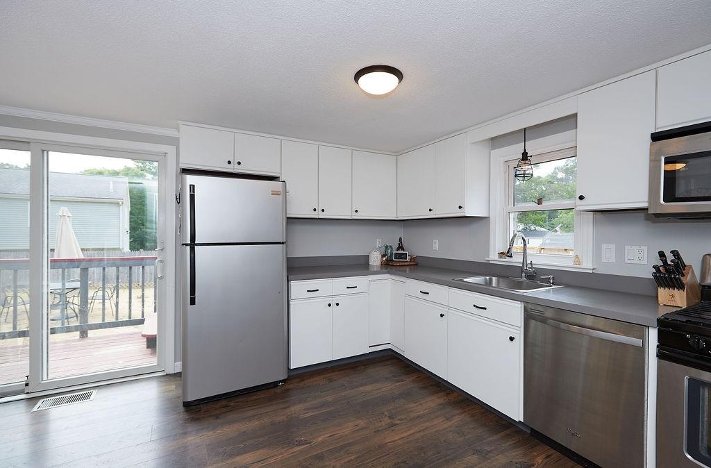 68 Barker Road Wareham, MA 02538 - Photo 9 of 17 a kitchen with a refrigerator sink and cabinets