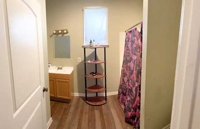 a bathroom with a sink and a mirror