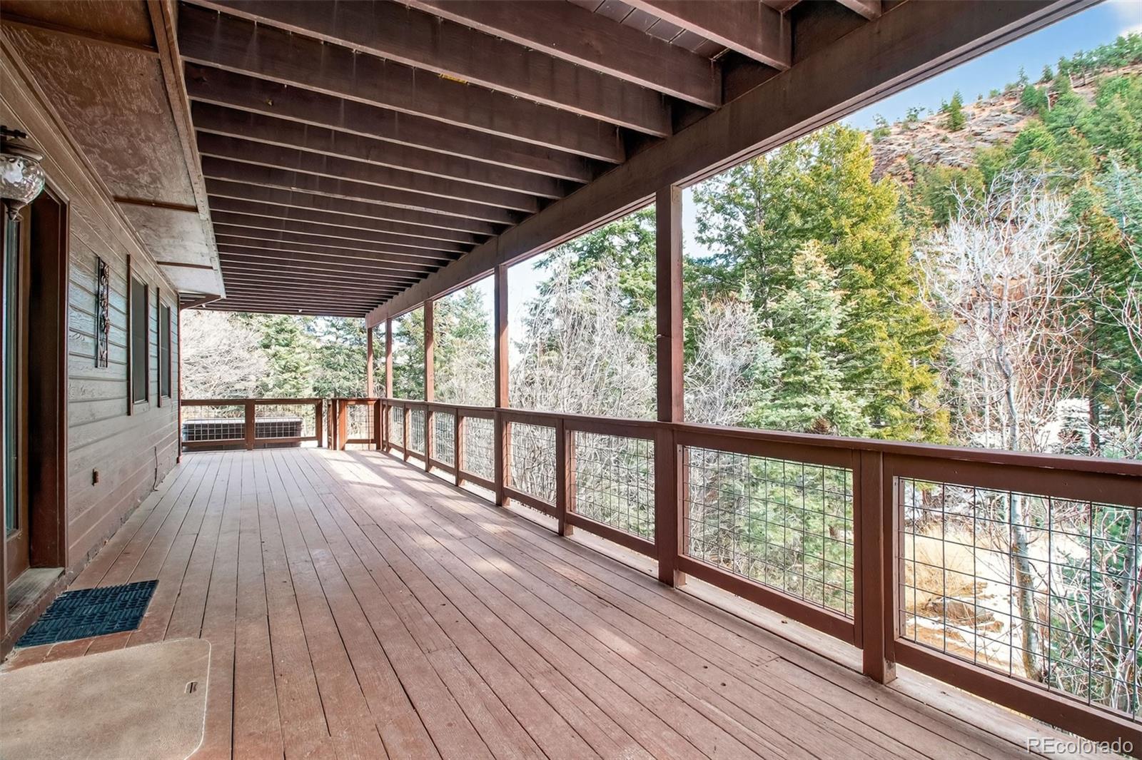 1445 Sutherland Road Manitou Springs, CO 80829 - Photo 33 of 43 a view of a balcony with wooden floor