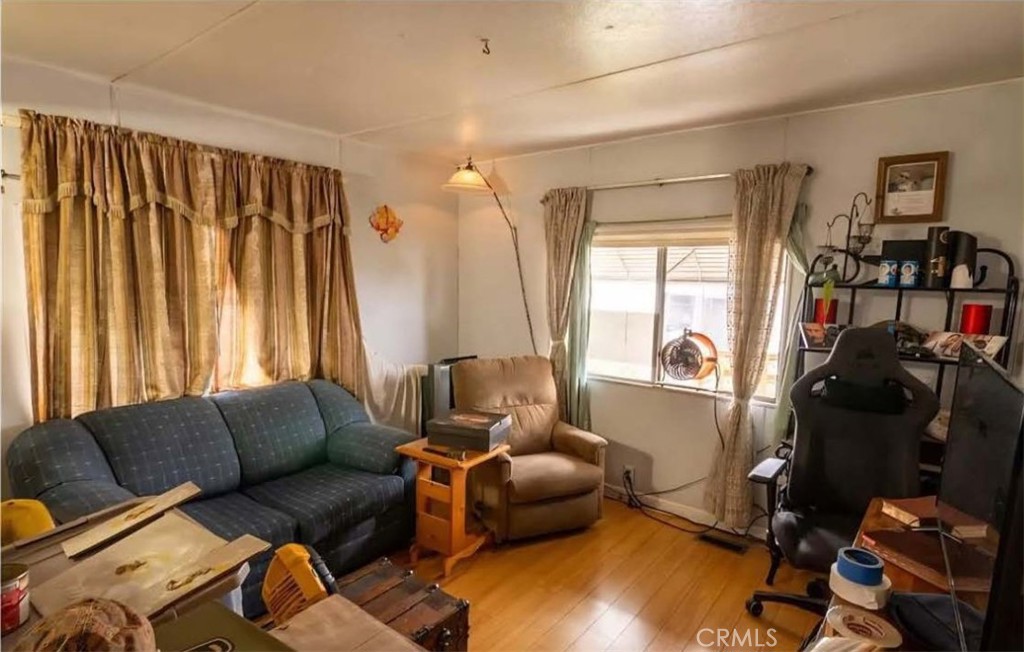 4849 Peck Road, Unit 39 El Monte, CA 91732 - Photo 3 of 6 a living room with furniture and a flat screen tv