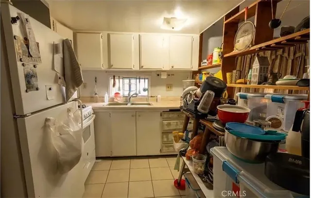 a view of storage and utility room with racks on the wall