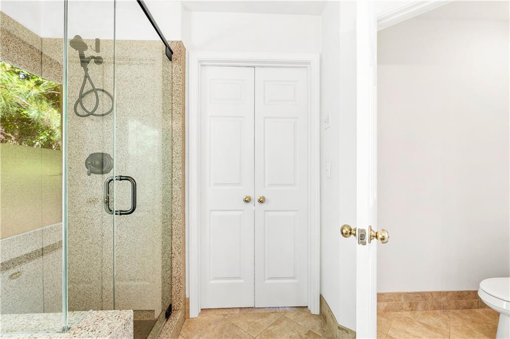 873 Red Rock Court Suwanee, GA 30024 - Photo 26 of 36 a bathroom with a shower