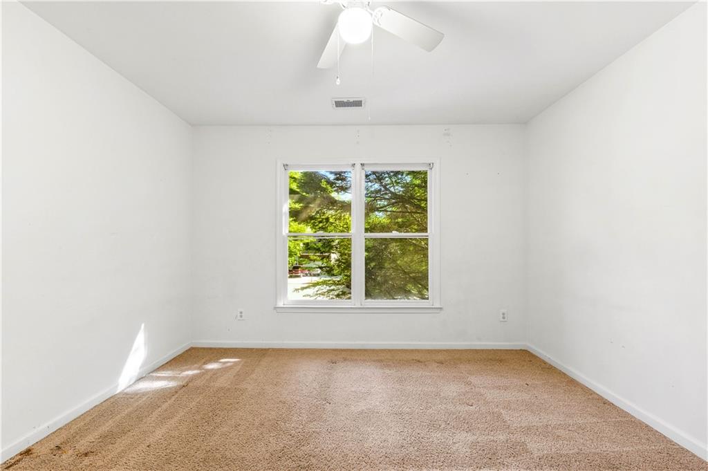 873 Red Rock Court Suwanee, GA 30024 - Photo 27 of 36 an empty room with a window
