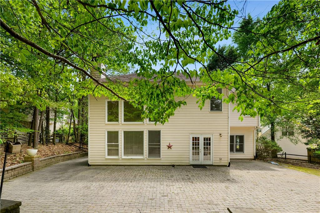 873 Red Rock Court Suwanee, GA 30024 - Photo 3 of 36 a house with a tree in front of it