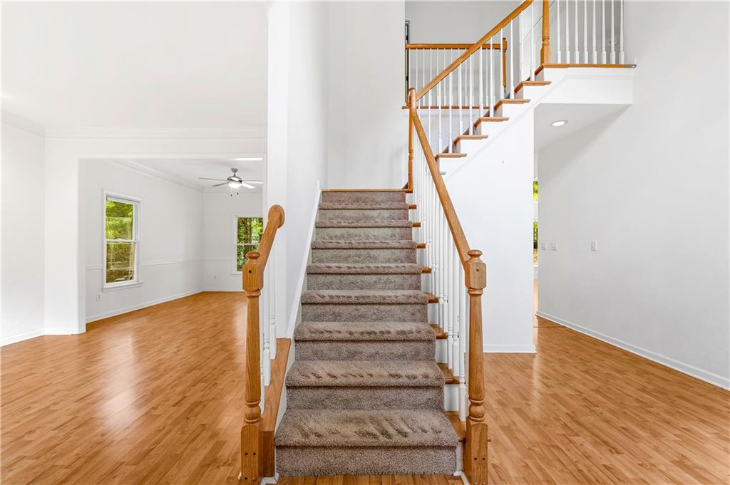 873 Red Rock Court Suwanee, GA 30024 - Photo 6 of 36 a view of entryway with wooden floor