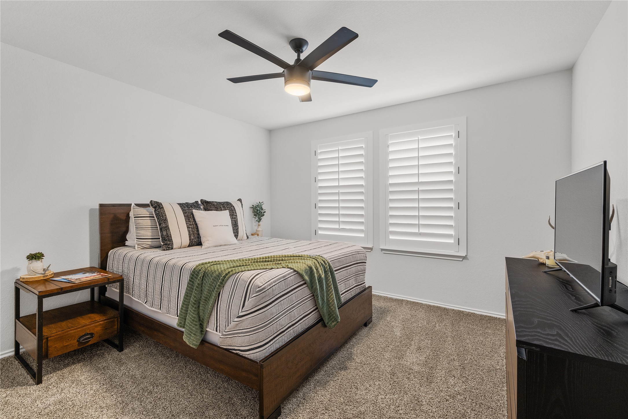 583 Taggart Trail Jarrell, TX 76537 - Photo 15 of 21 Bedroom with a ceiling fan and carpet flooring