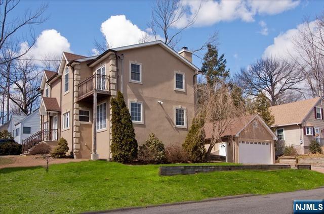 177 Magnolia Avenue Cresskill, NJ 07626 - Photo 14 of 15 a front view of house with yard
