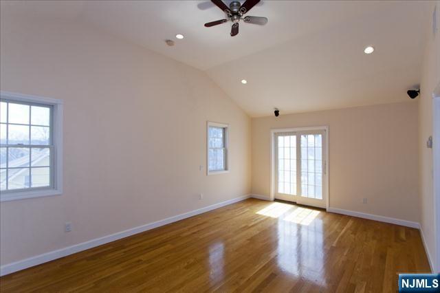 177 Magnolia Avenue Cresskill, NJ 07626 - Photo 9 of 15 wooden floor in an empty room with a window