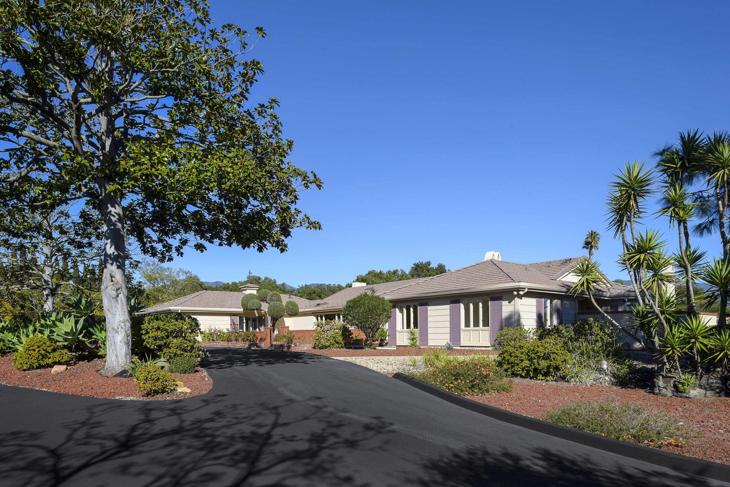 4460 Via Alegre Santa Barbara, CA 93110 - Photo 1 of 18 a front view of a house with a yard and a garage