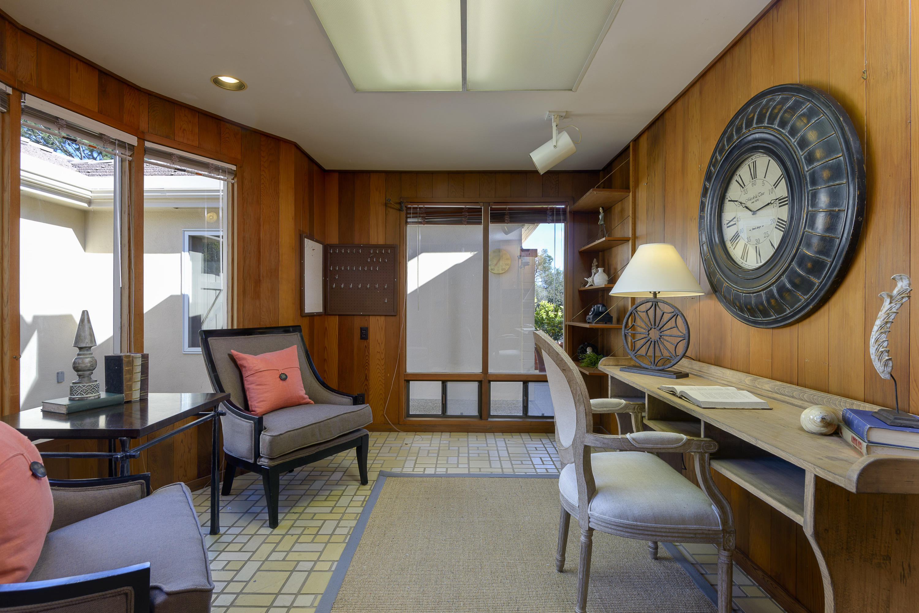 4460 Via Alegre Santa Barbara, CA 93110 - Photo 12 of 18 a living room with furniture a clock and a large window