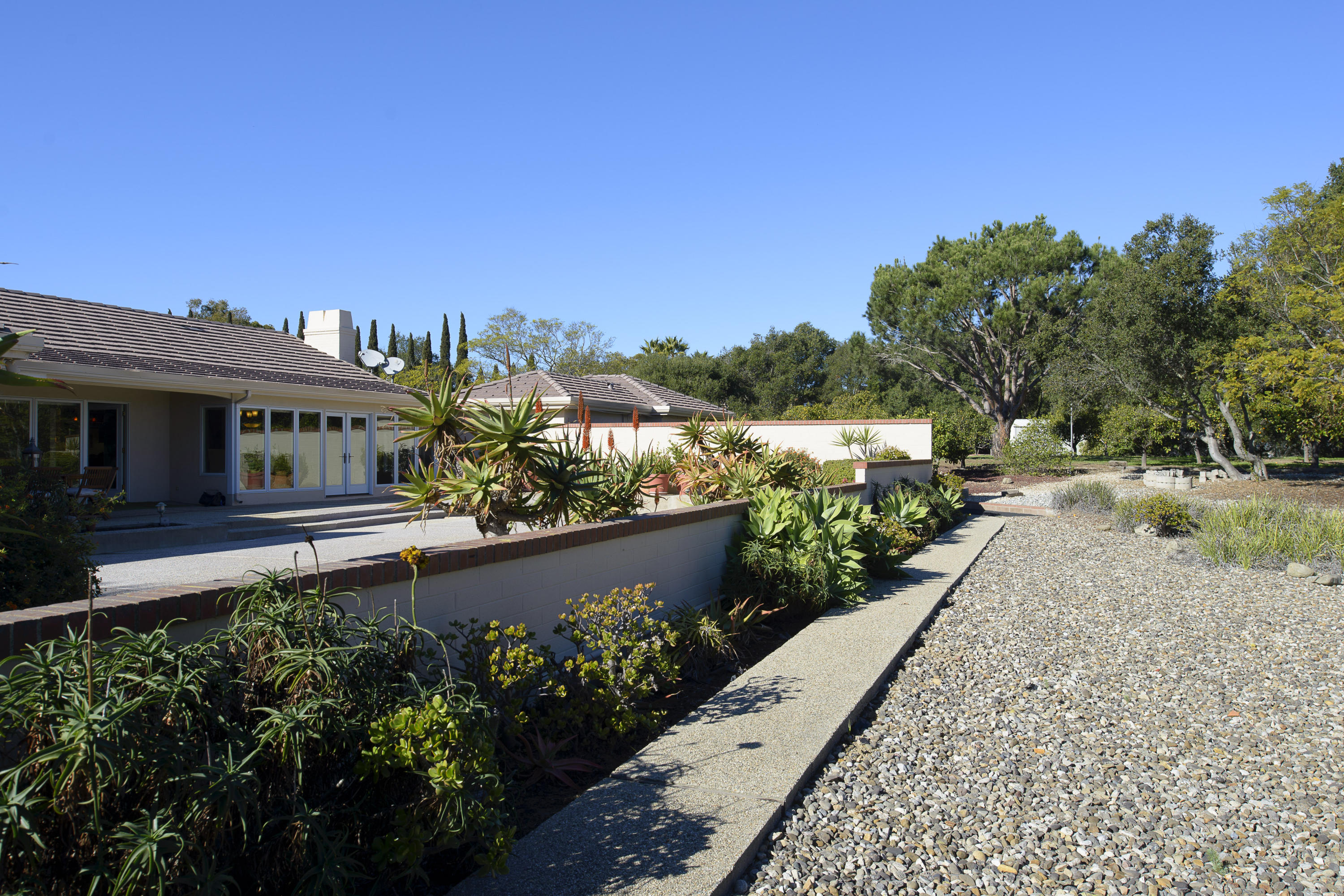 4460 Via Alegre Santa Barbara, CA 93110 - Photo 15 of 18 a view of a house with a yard