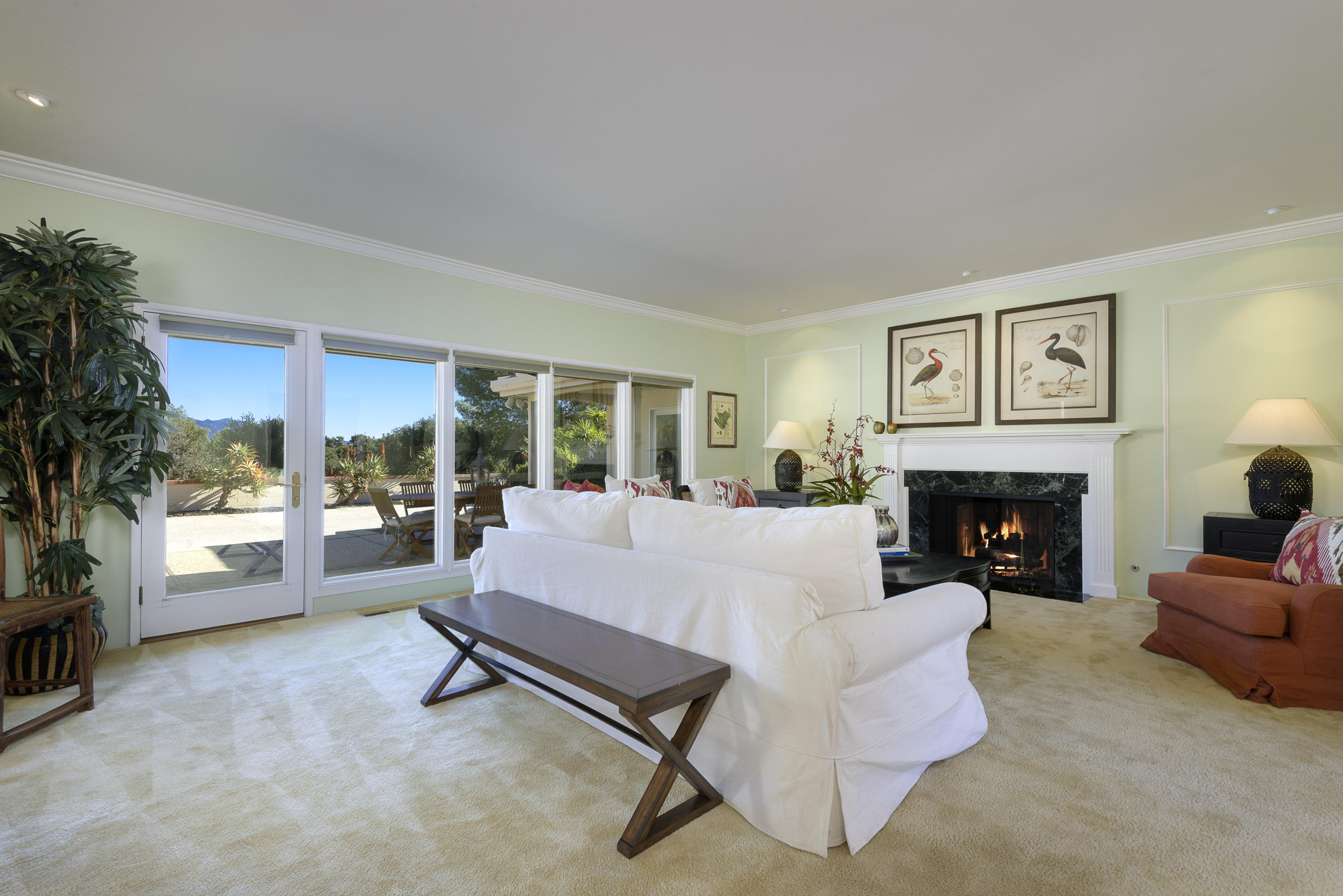 4460 Via Alegre Santa Barbara, CA 93110 - Photo 4 of 18 a living room with furniture and a fireplace