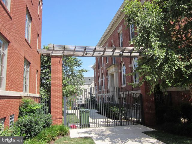 a building with trees in front of it