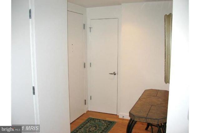 a room with a chair and painted wall