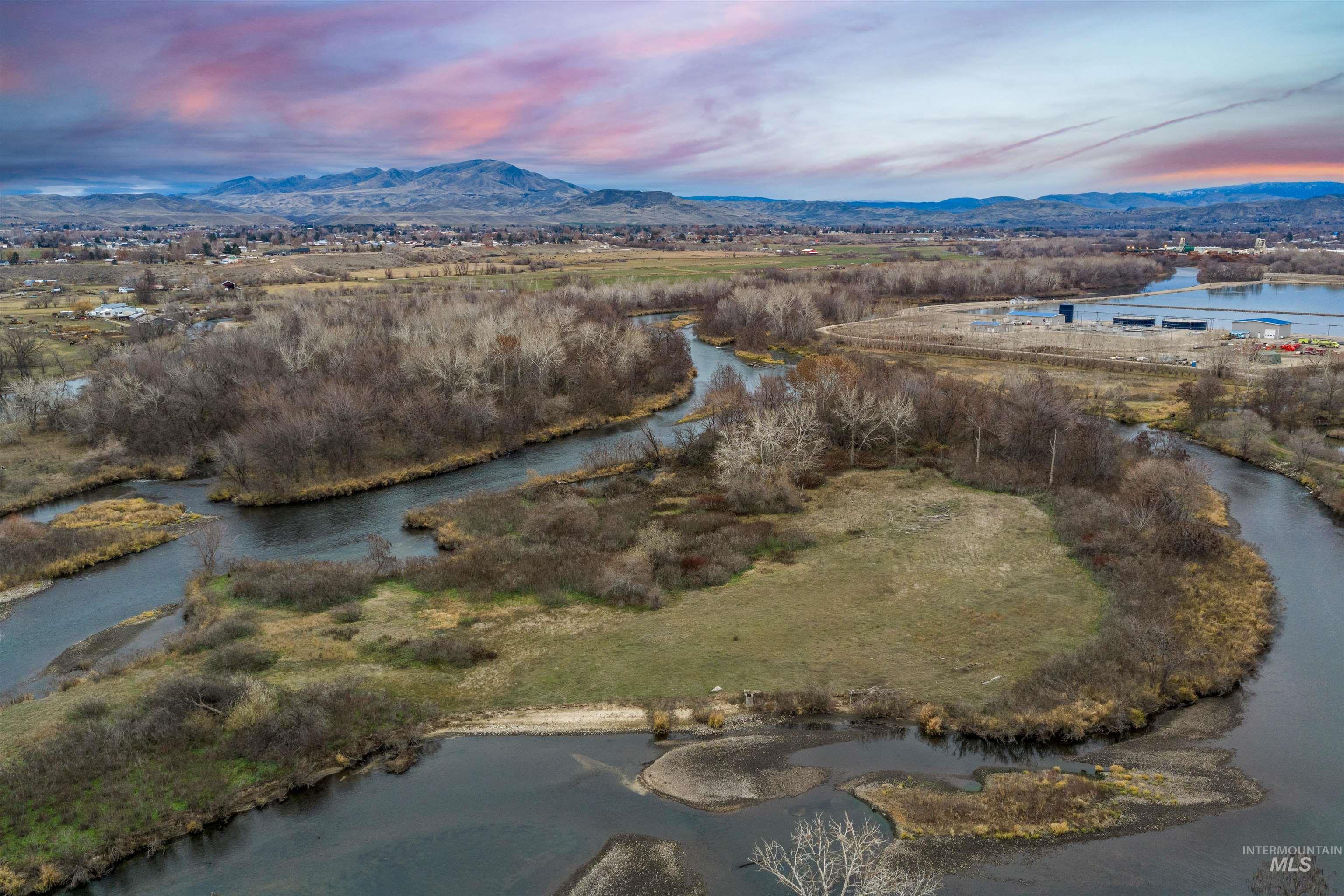 Tbd Cascade Road Emmett, ID 83617 - Photo 15 of 40 Aerial view at dusk of a water and mountain view