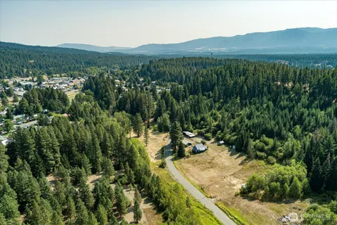 a view of a mountain with a yard