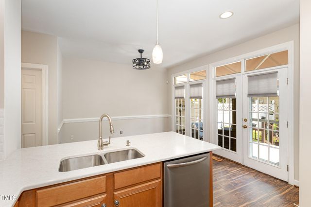 a kitchen with a sink and a refrigerator