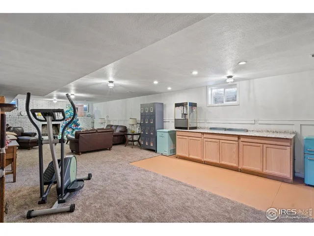 a view of a living room kitchen and a large window