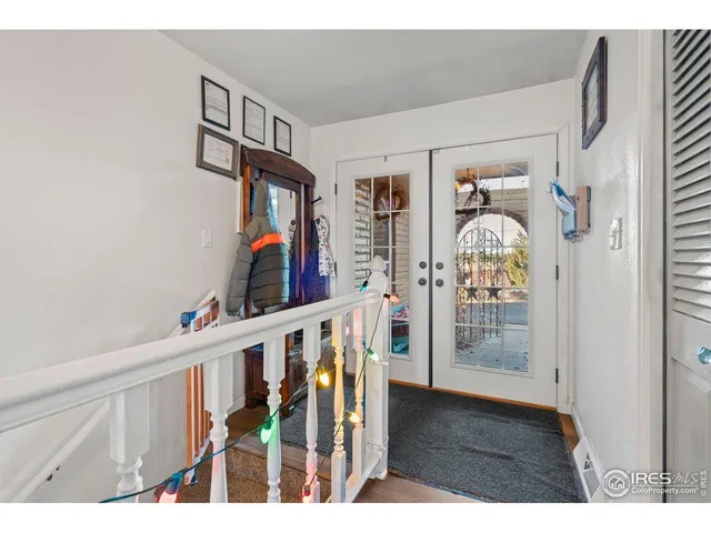 a view of an entryway and wooden floor