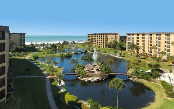 an aerial view of a house with a lake view