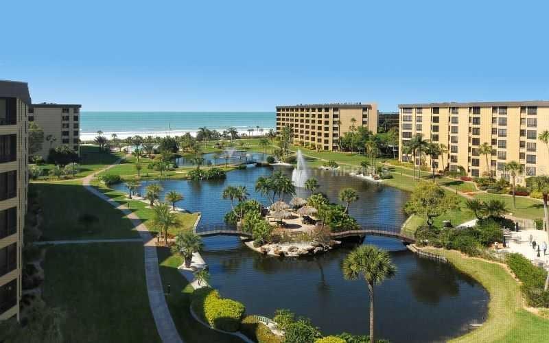 5770 Midnight Pass Road, Unit 605 Sarasota, FL 34242 - Photo 1 of 42 an aerial view of a house with a lake view