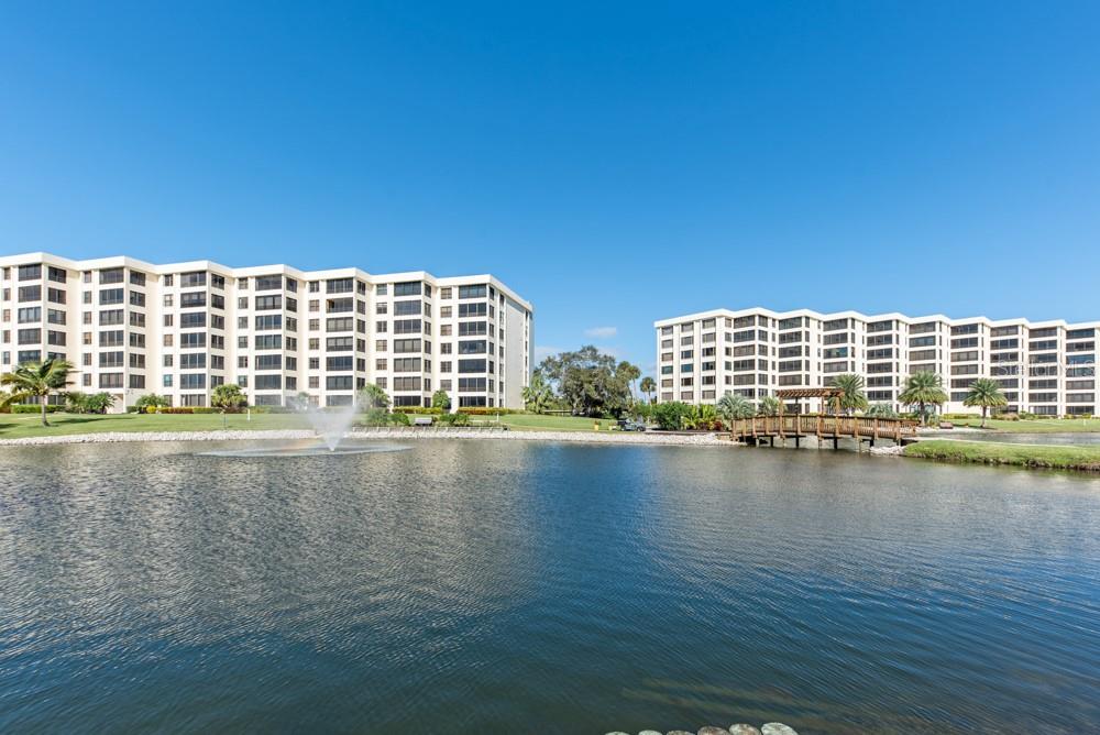 5770 Midnight Pass Road, Unit 605 Sarasota, FL 34242 - Photo 26 of 42 a view of a building with lake view
