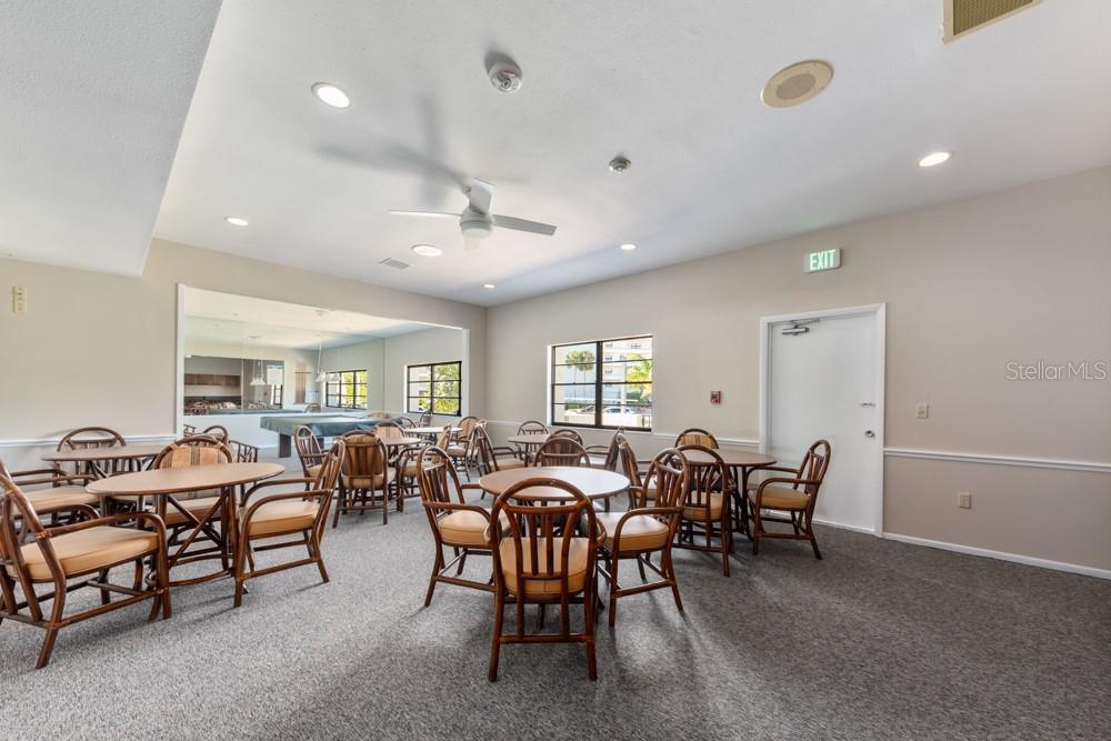 5770 Midnight Pass Road, Unit 605 Sarasota, FL 34242 - Photo 38 of 42 a view of a dining room with furniture