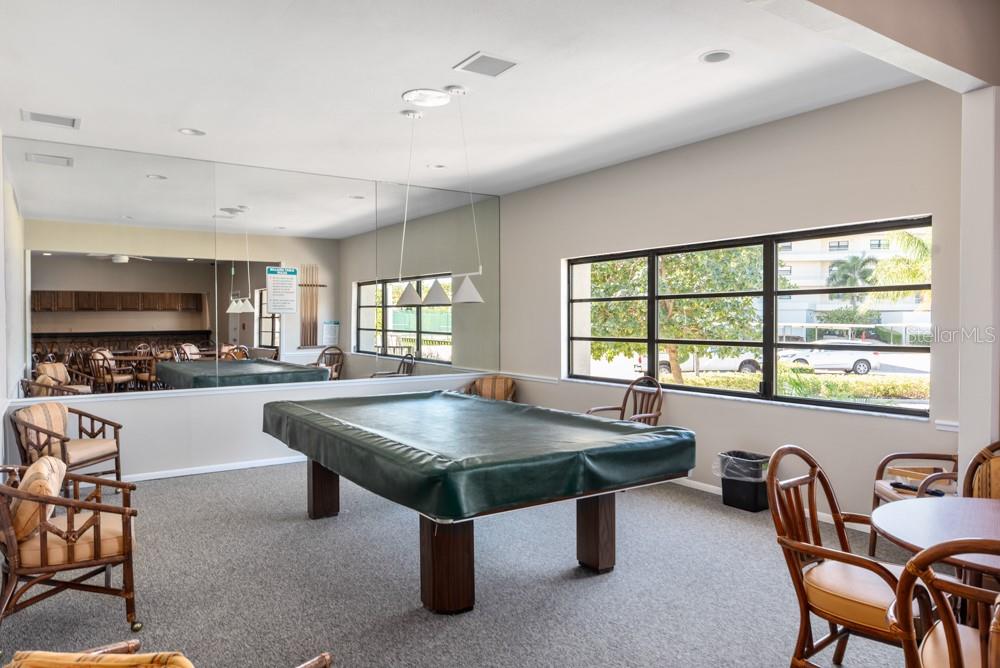 5770 Midnight Pass Road, Unit 605 Sarasota, FL 34242 - Photo 39 of 42 a room with furniture pool table and flat screen tv