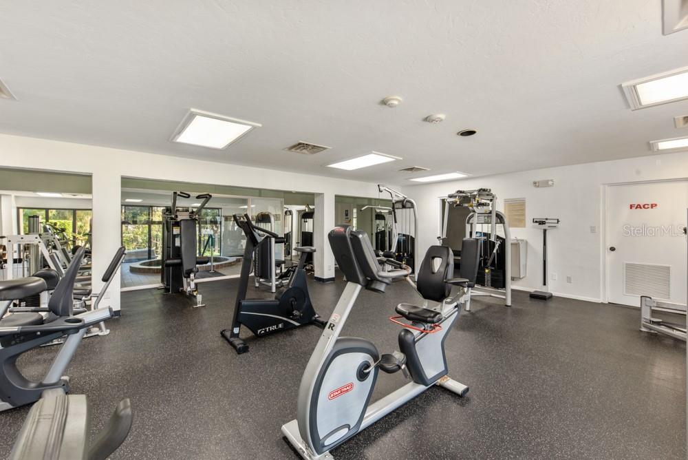 5770 Midnight Pass Road, Unit 605 Sarasota, FL 34242 - Photo 40 of 42 a view of a room with gym equipment