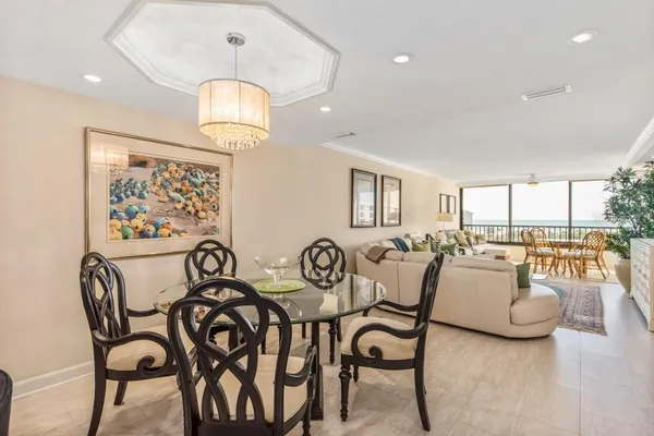a view of a dining room with furniture window and outside view