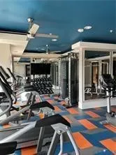 a room with lots of gym equipment