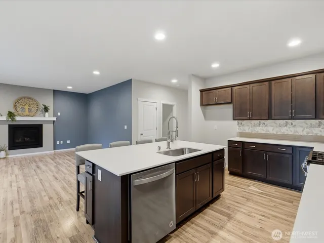 a kitchen with a sink and cabinets