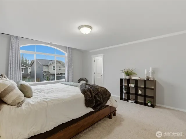 a spacious bathroom with a double vanity sink mirror and bathtub