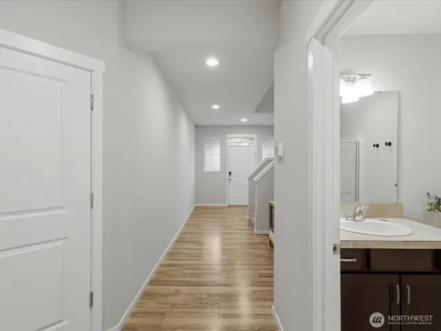 a view of a bathroom from the hallway