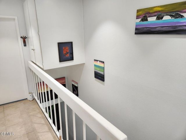 a view of a hallway with staircase